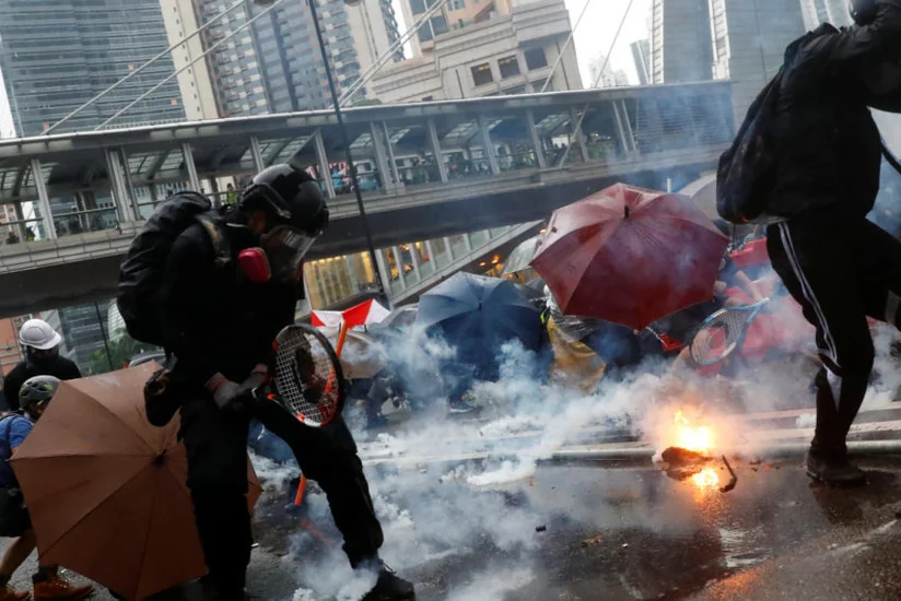 Hong Kong: Tear gas fired as protesters defy police