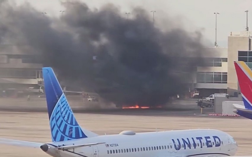 American Airlines flight catches fire at Denver airport