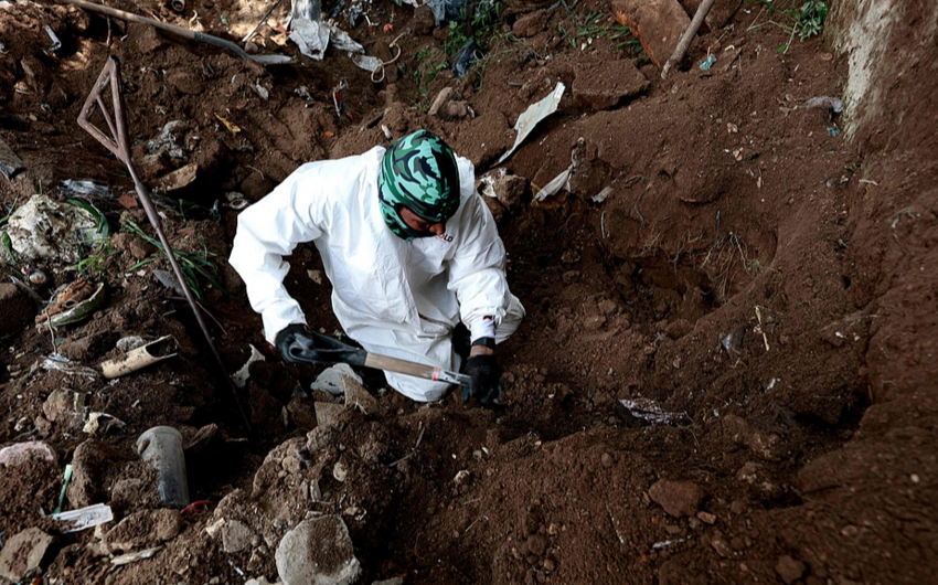 At least 56 bodies found in Mexico in unmarked graves near US border, local prosecutors say