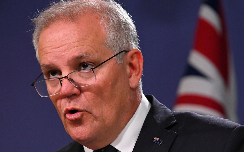 Australian PM Scott Morrison crashes into child during soccer training