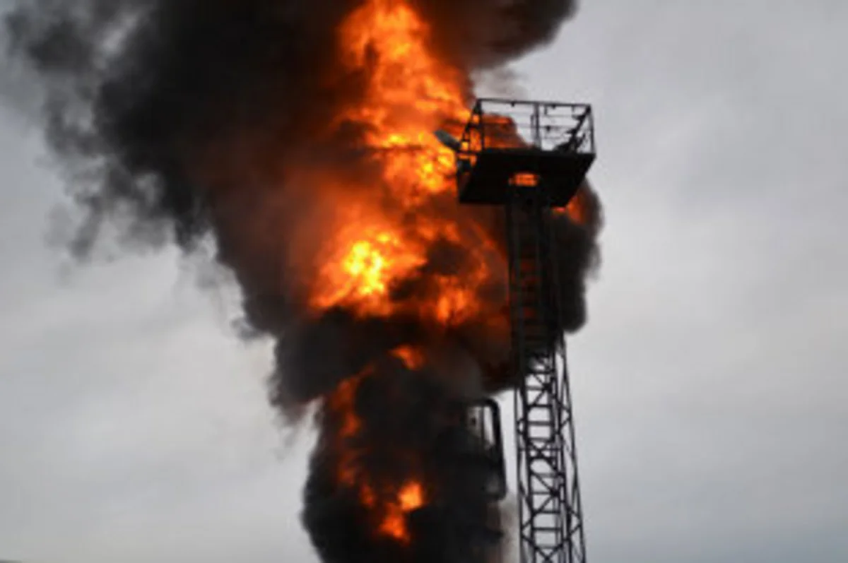 Iran's oil depot burns for third day