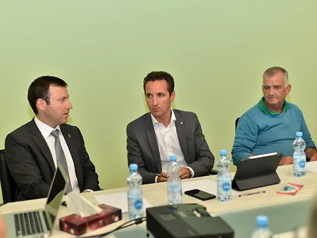 UEFA representatives view grass cover at Baku Olympic Stadium