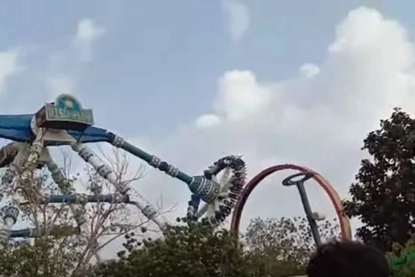 Two die and dozens are injured in theme park ride accident in India
