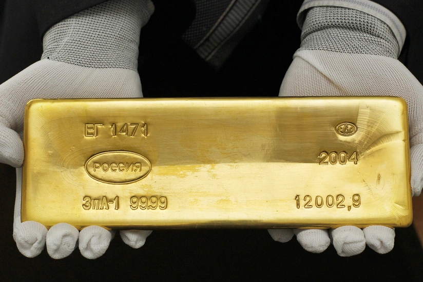 Gold rises as dollar softens