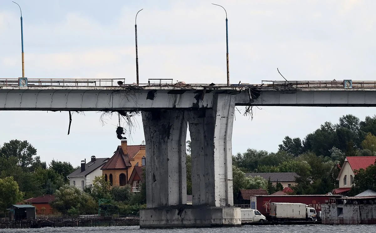 Bridge partially collapses as freight train was moving across it