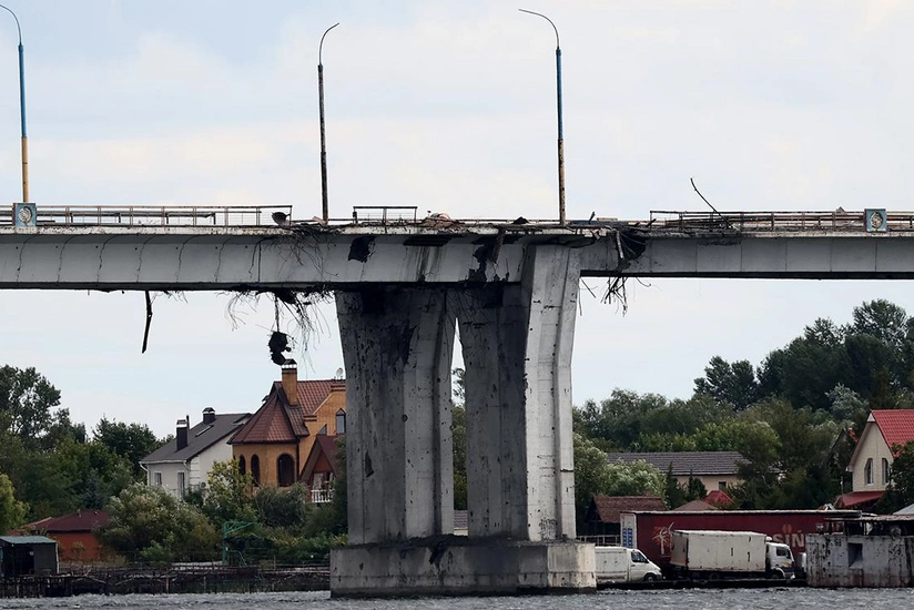 Bridge partially collapses as freight train was moving across it