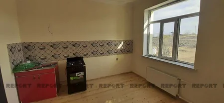 Goranboyda mərmi düşən ev yenidən tikilərək sahibinə verilib