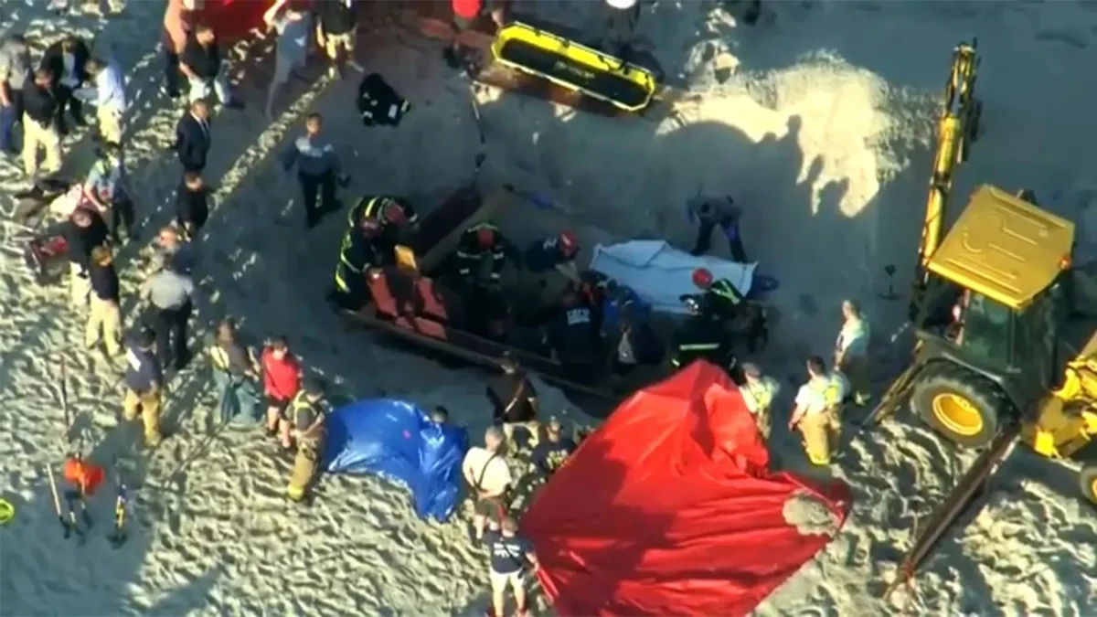 US teen digging hole on beach dead after being buried under collapsed sand
