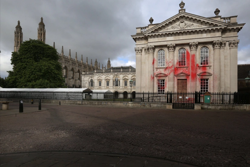 Pro-Palestinian protesters spray red paint on Cambridge graduation building