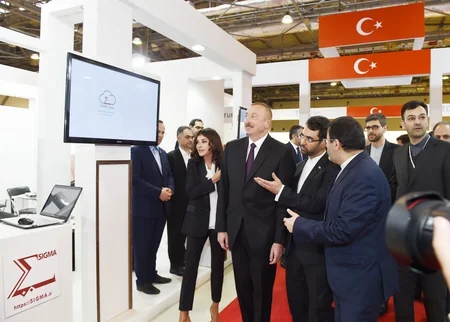 President Ilham Aliyev views Bakutel 2018 exhibition