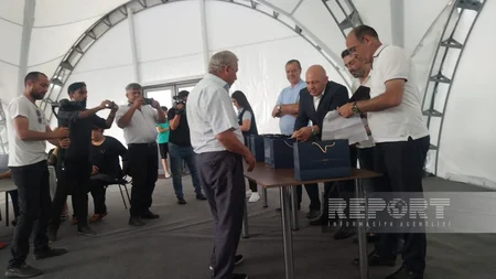 Families returning to Lachin receive keys to their homes