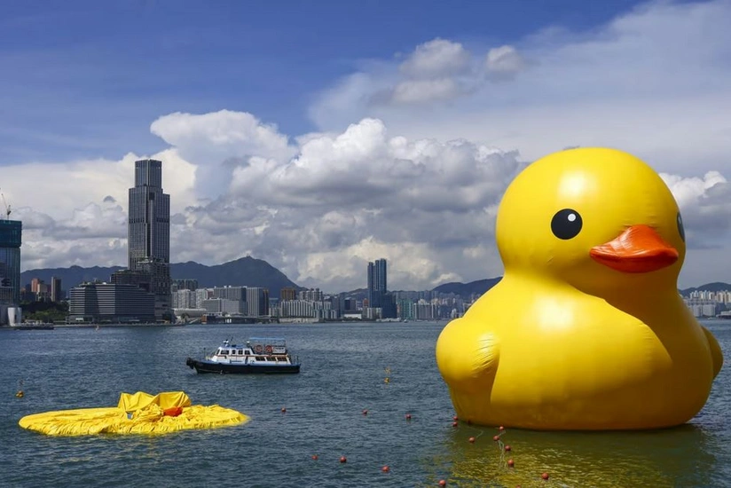 One of two giant rubber ducks in Hong Kong harbour deflates
