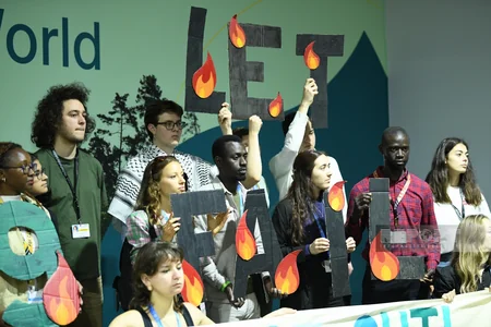 Участники эко-акции на COP29 выступили с требованием достижения климатической справедливости
