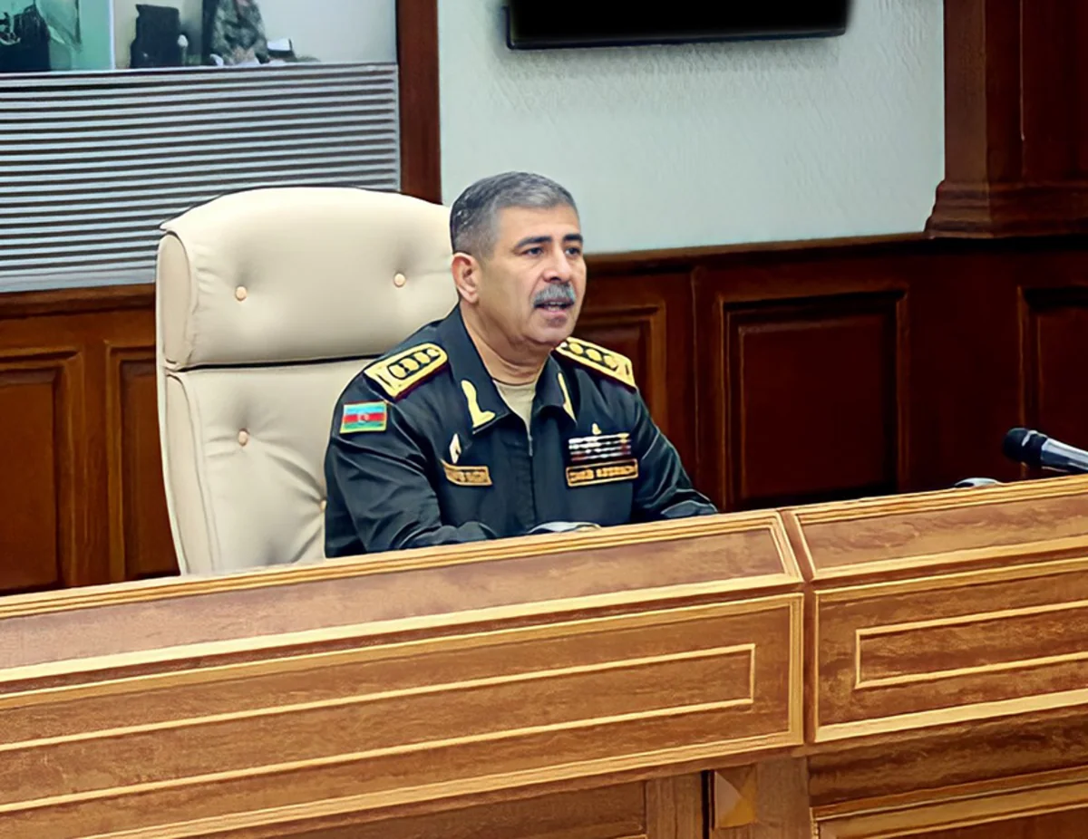 Minister of Defense gives instructions to troops during official meeting