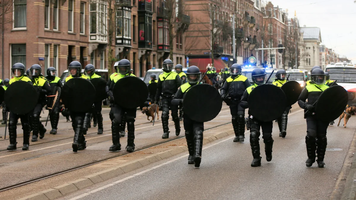 Police cars torched during rioting between rival groups of Eritreans in Netherlands