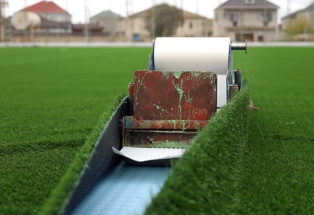 Binə qəsəbə stadionunda süni ot örtüyünün dəyişdirilməsi işləri davam etdirilir