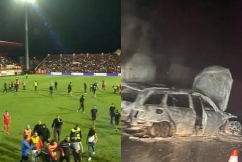 Futbol matçında azarkeşlər meydana girib, referinin avtomobili yandırılıb