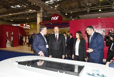 President Ilham Aliyev views Bakutel 2018 exhibition
