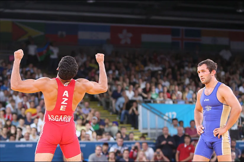 Olimpiada finalında Toğrul Əsgərovla qarşılaşmış güləşçi medaldan məhrum edilib