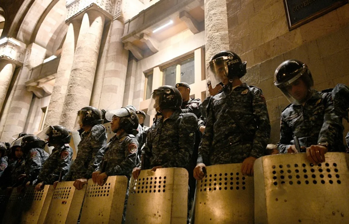 Over 100 injured in clashes at Armenian parliament