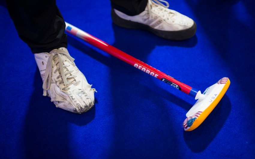 Olympic curler from US takes part in rip shoes