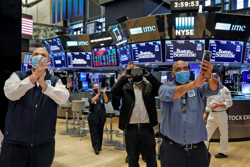 Stocks climb to all-time high on vaccine progress