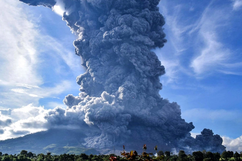 Eleven climbers killed as Indonesia volcano erupts, search on hold
