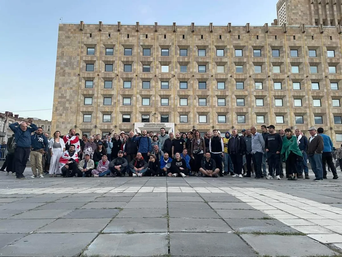 Protestors gather around government building in Tbilisi as demonstrations continue