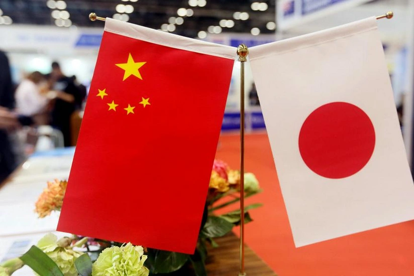 China's FM urges Japan to take concrete actions to improve ties