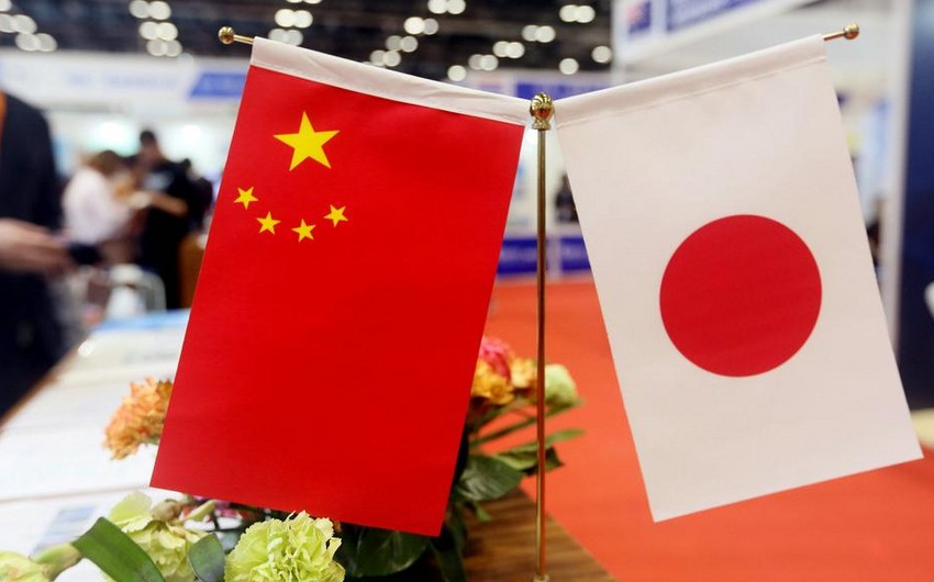 China's FM urges Japan to take concrete actions to improve ties