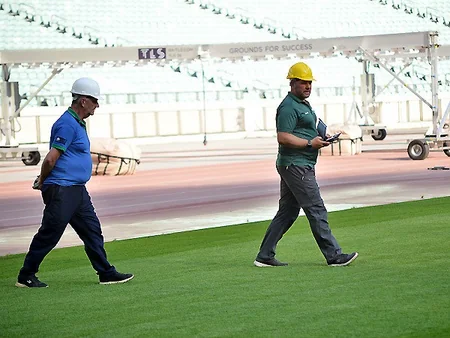 UEFA representatives view grass cover at Baku Olympic Stadium