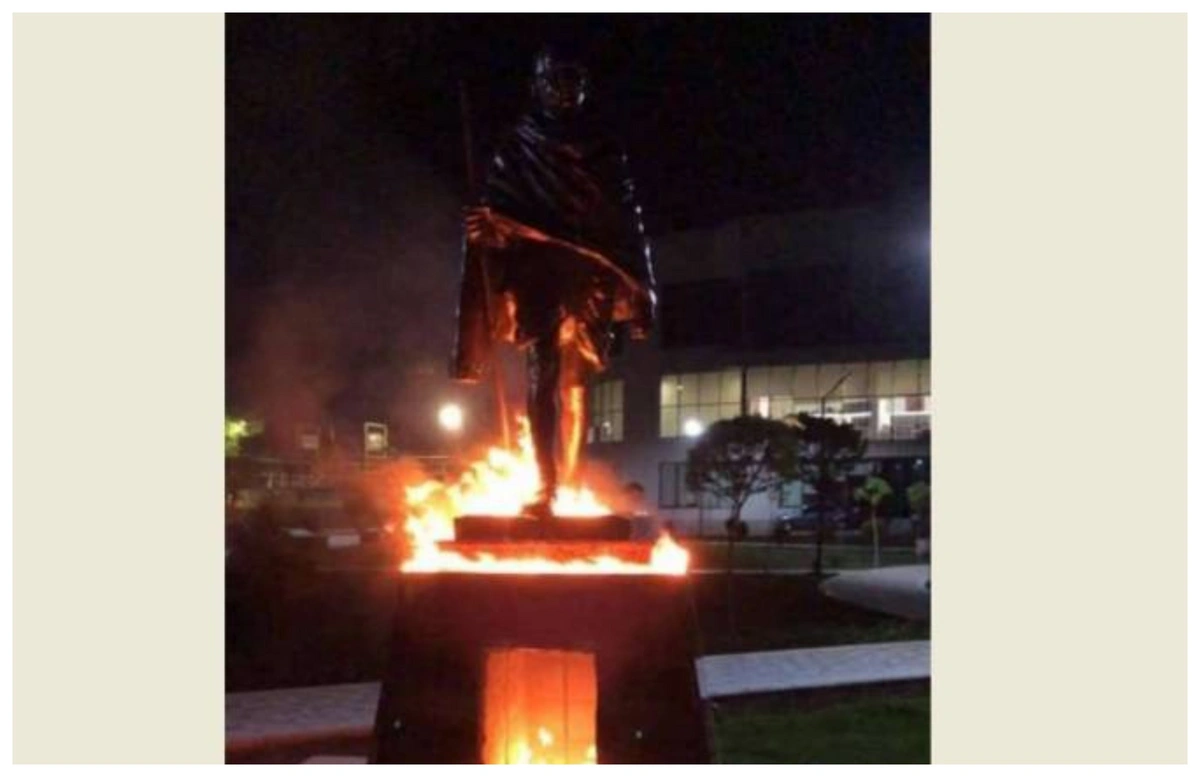 Why was Mahatma Gandhi's statue set on fire in Yerevan?