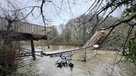 US railroad bridge collapses under train, railcar crashes into river