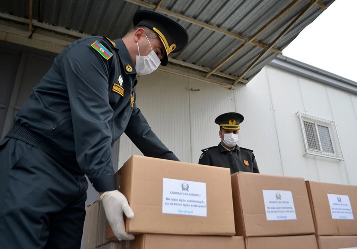 Azerbaijani servicemen deliver assistance to martyrs' families - VIDEO