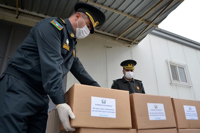 Azerbaijani servicemen deliver assistance to martyrs' families - VIDEO