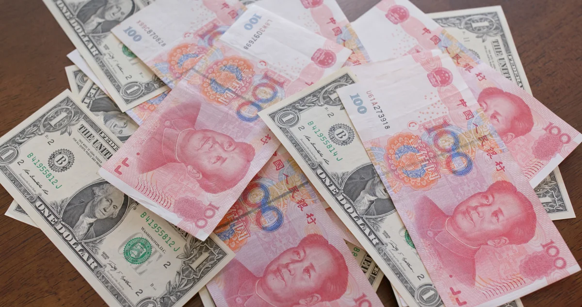 PBOC strengthens yuan against dollar