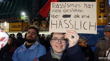 Almaniyada minlərlə insan irqçi terroru lənətlədi - FOTO