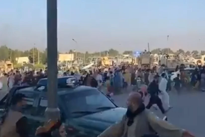 Hundreds of Afghans flee country as Kabul falls into Taliban's hands