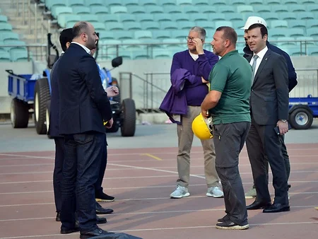 UEFA representatives view grass cover at Baku Olympic Stadium