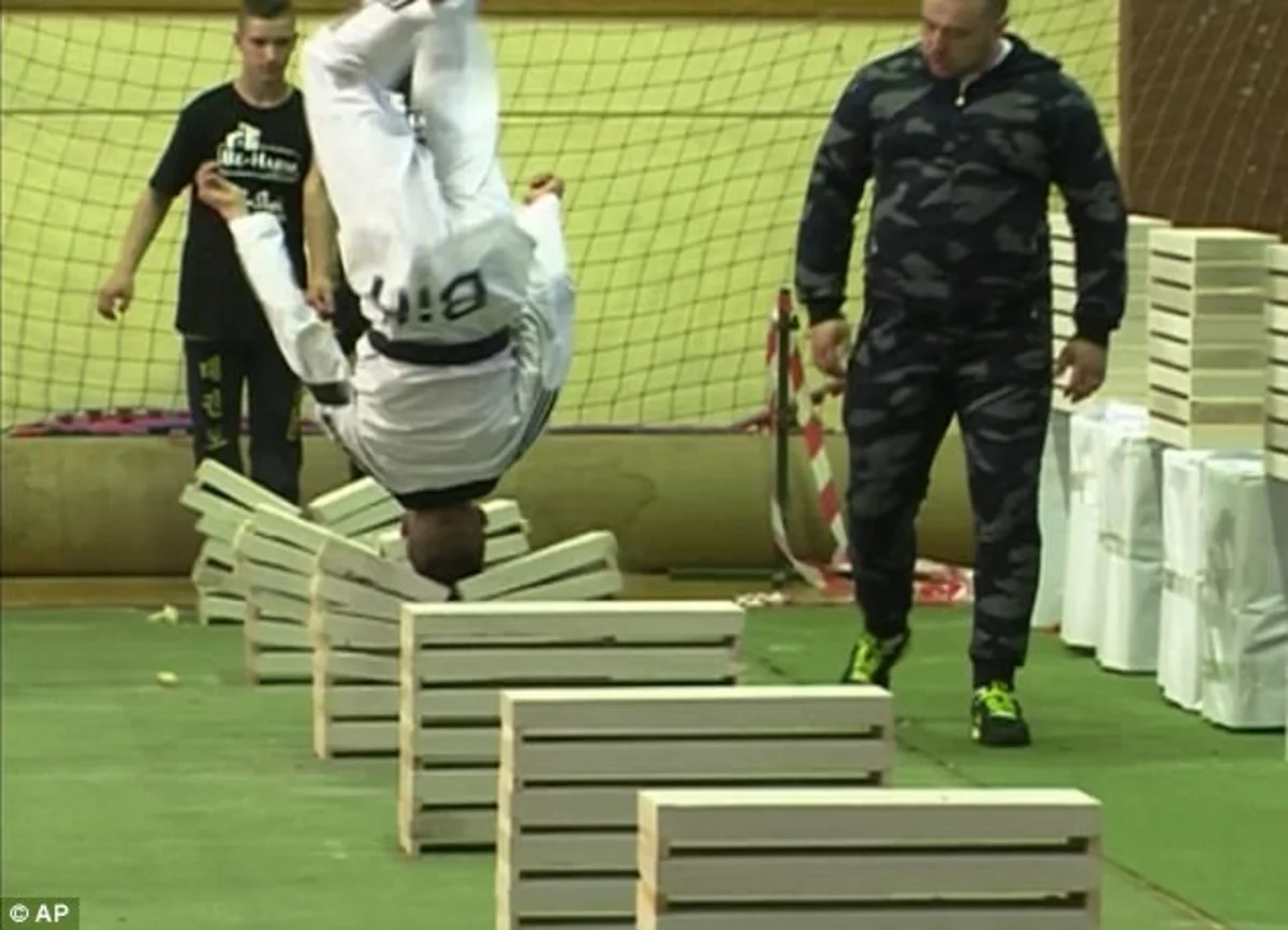 16 year old champion makes record in breaking concrete slabs using head - VIDEO