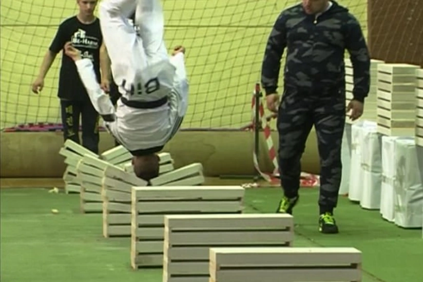 16 year old champion makes record in breaking concrete slabs using head - VIDEO
