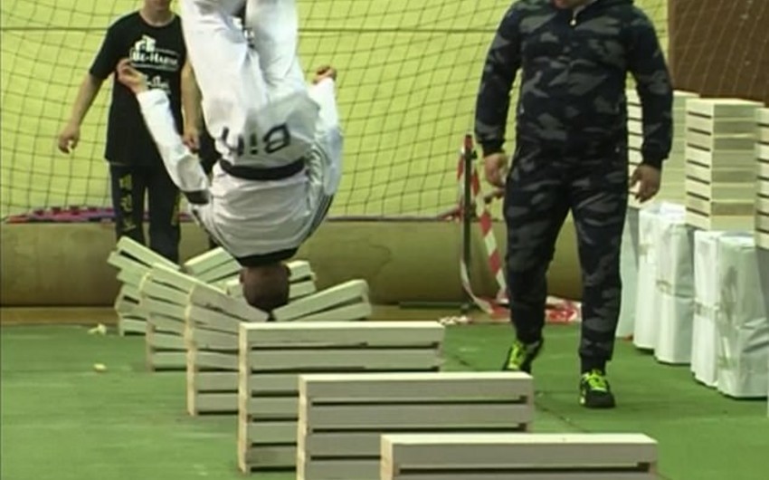 16 year old champion makes record in breaking concrete slabs using head - VIDEO