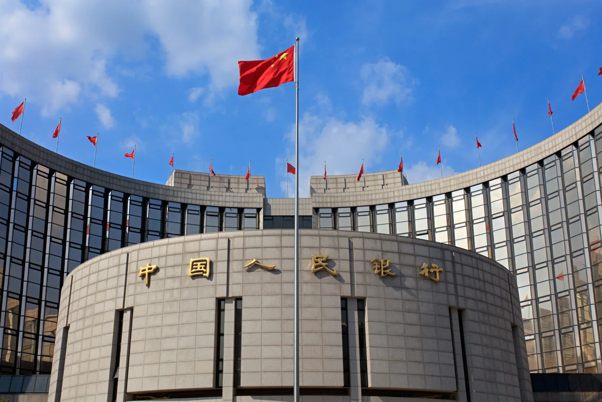 China cuts benchmark lending rates for first time in 7 months